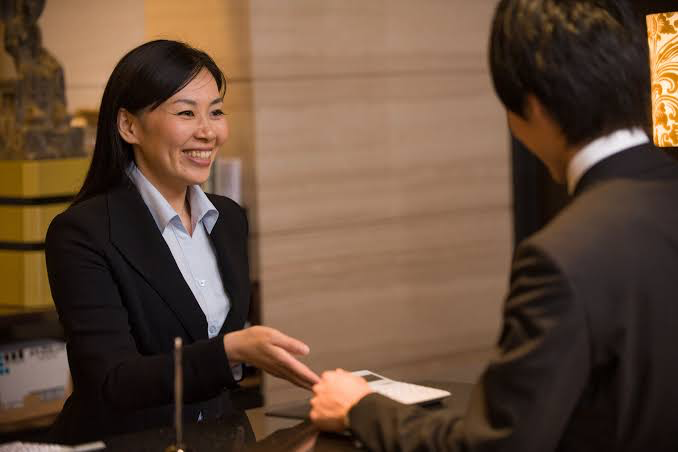 A concierge carrying out her duty